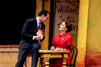 Sky Masterson (Matt Bogart) introduces himself to Sister Sarah (Kerry Conte) in Guys and Dolls.
